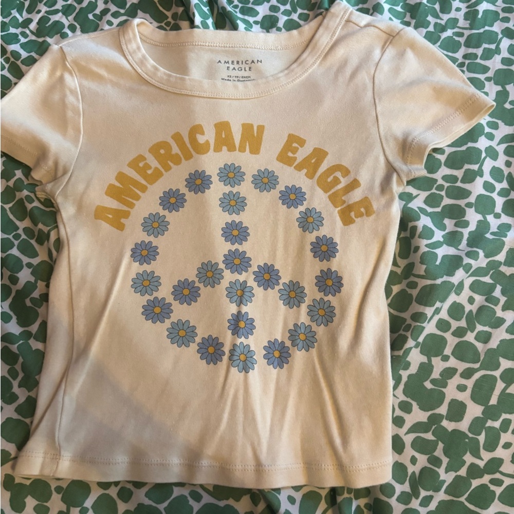 American Eagle Outfitters Women’s Cream Peace Sign Baby T-Shirt